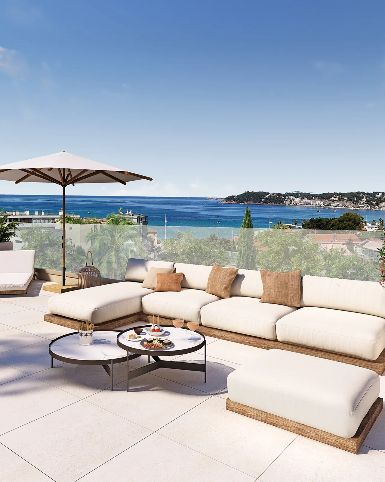 Rooftop du lot 21 : salon d'angle, parasol et vue sur la mer